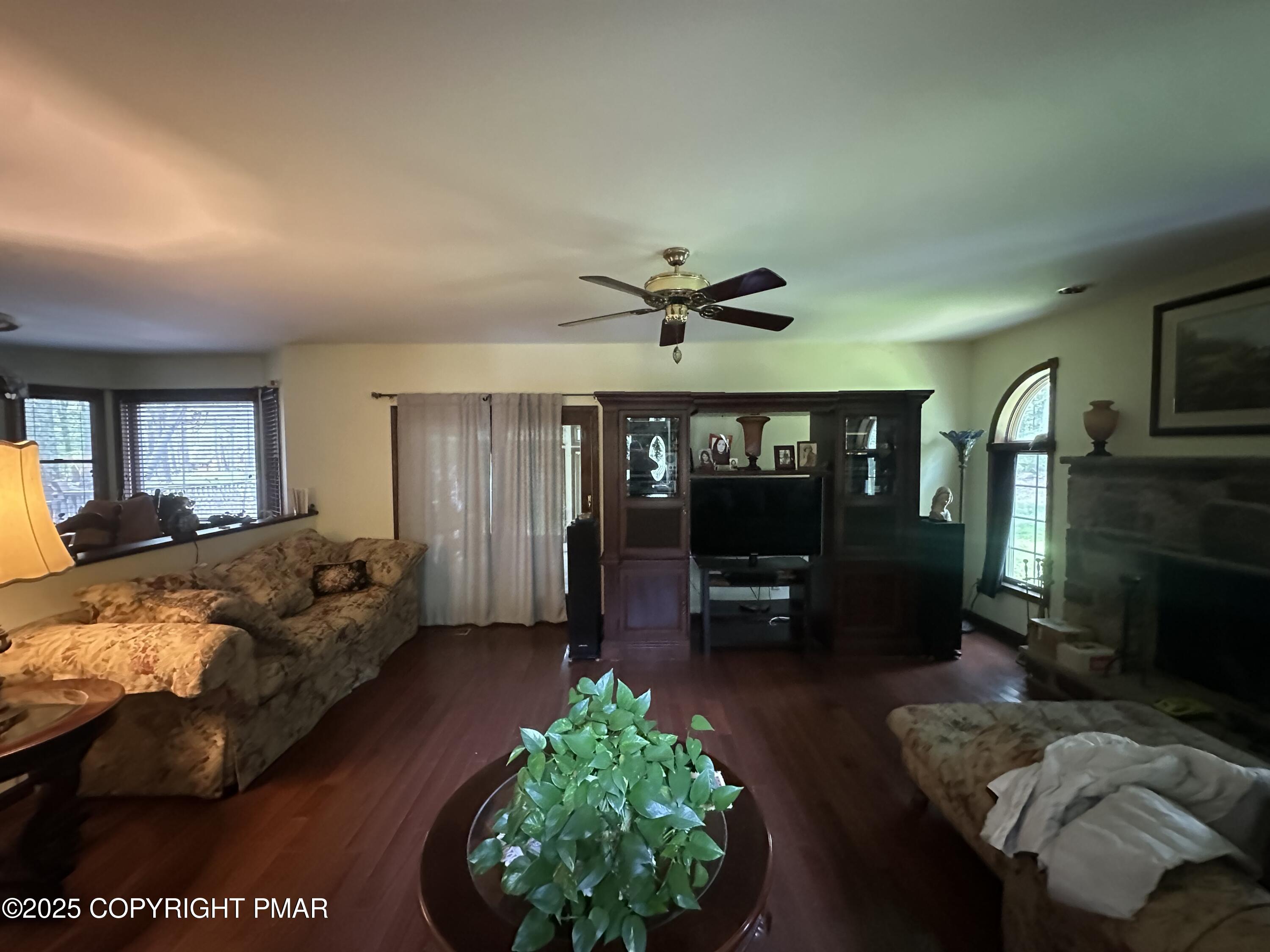 2162 Longview Drive Bushkill, PA 18324 - Photo 12 of 33 a living room with furniture and a floor to ceiling window
