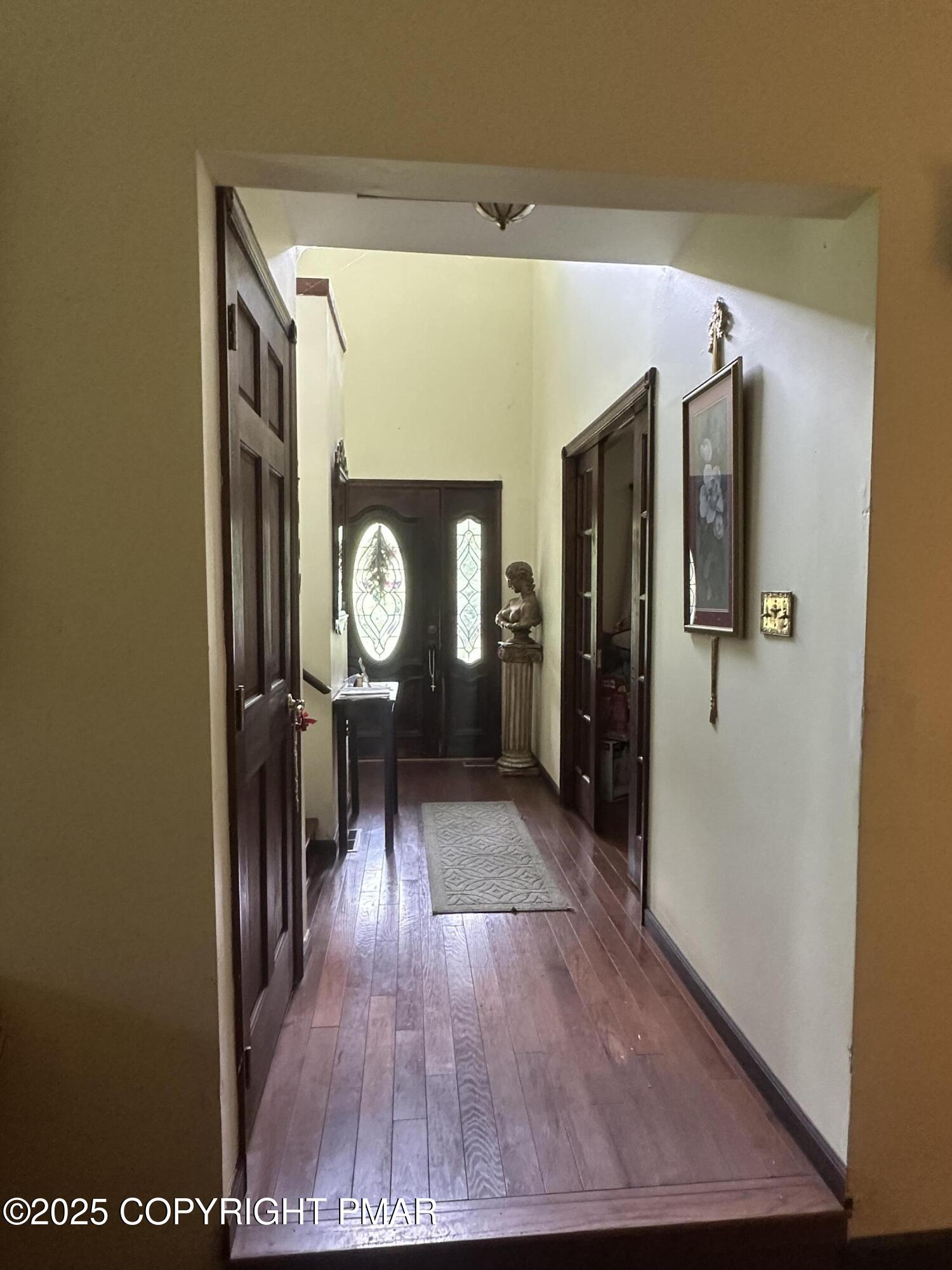 2162 Longview Drive Bushkill, PA 18324 - Photo 16 of 33 a view of a hallway with wooden floor
