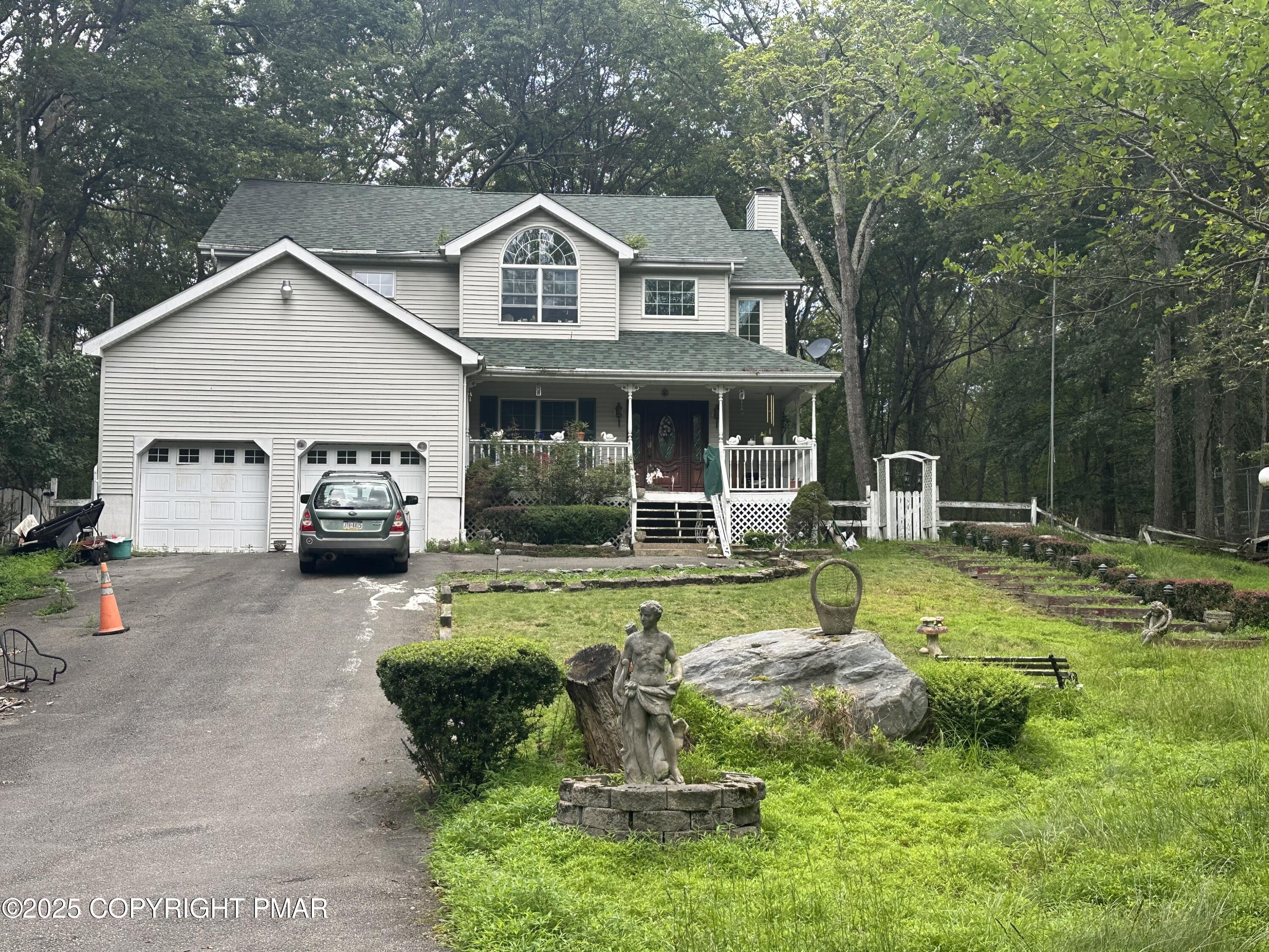2162 Longview Drive Bushkill, PA 18324 - Photo 2 of 33 a view of a house with backyard sitting area and swimming pool