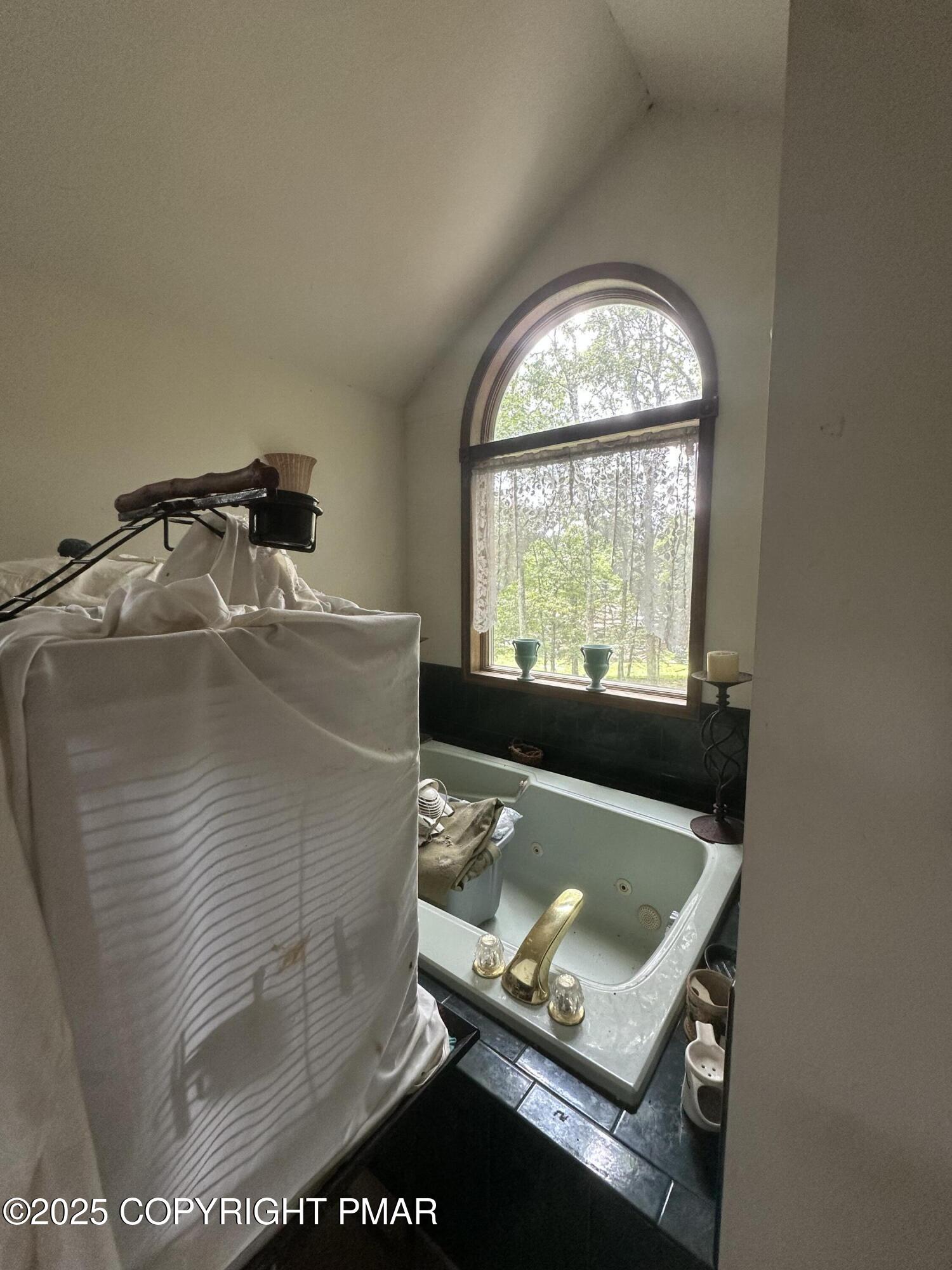 2162 Longview Drive Bushkill, PA 18324 - Photo 23 of 33 a view of a living room with a bed and a window
