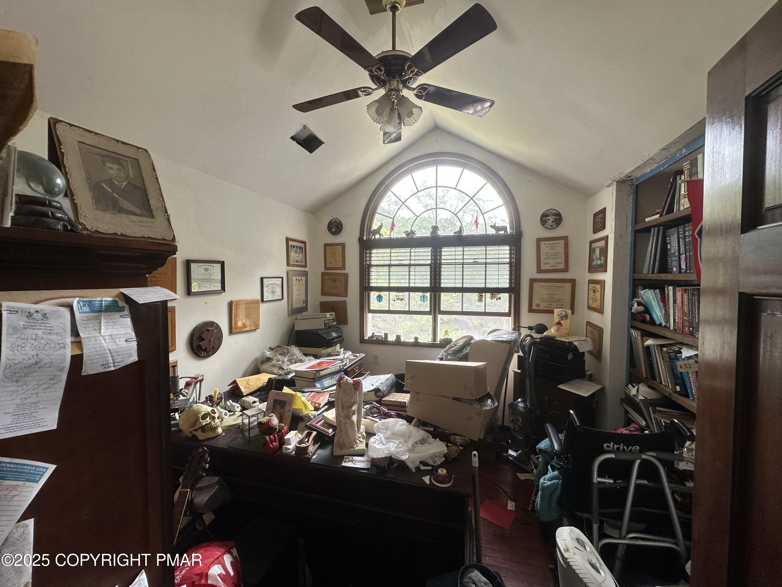 2162 Longview Drive Bushkill, PA 18324 - Photo 24 of 33 a living room with furniture a fireplace and a large window