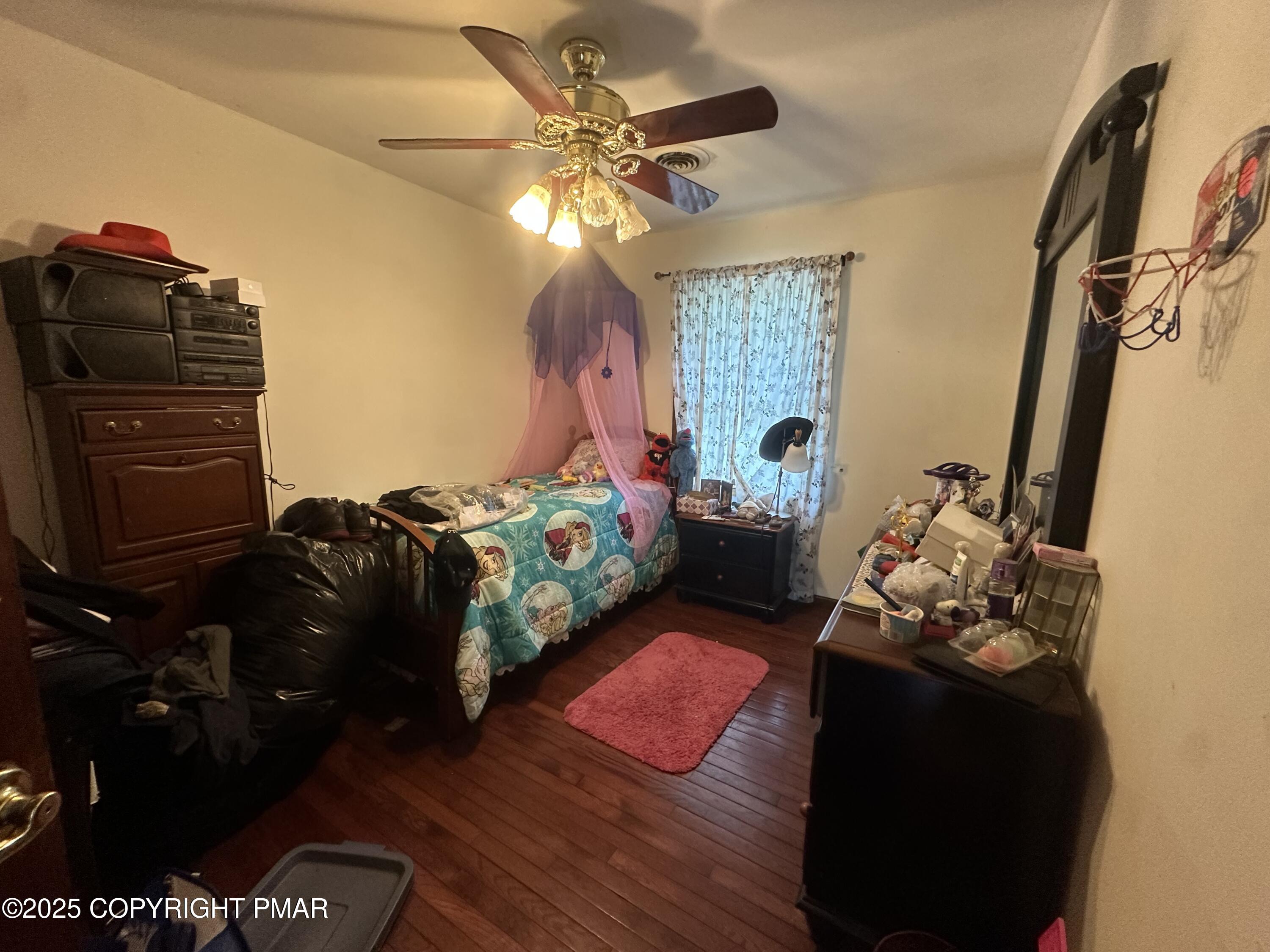 2162 Longview Drive Bushkill, PA 18324 - Photo 27 of 33 a bedroom with a bed dresser and a window