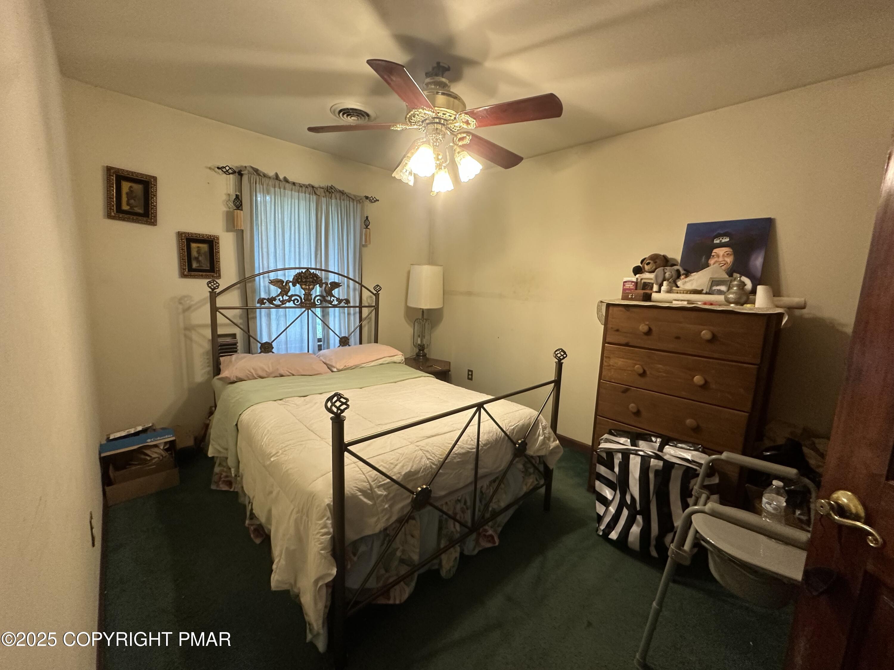 2162 Longview Drive Bushkill, PA 18324 - Photo 28 of 33 a bedroom with a bed and a chandelier