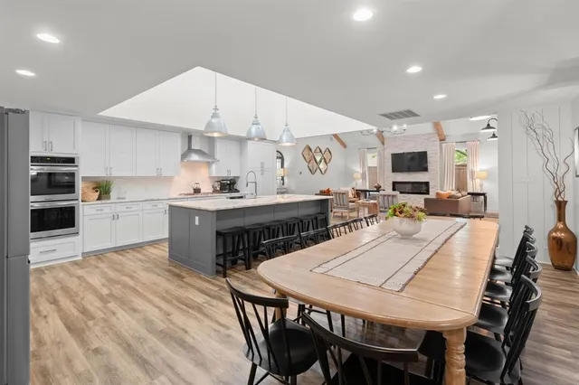a kitchen with a table and chairs in it