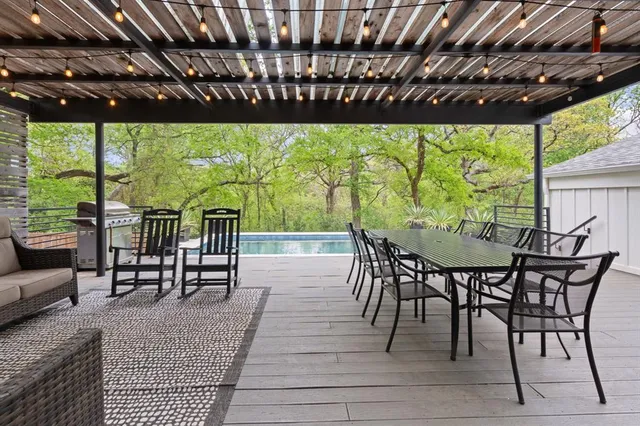 a view of a swimming pool with a yard