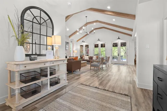 a living room with fireplace furniture and a flat screen tv
