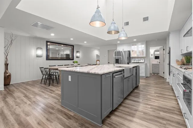 a living room with fireplace furniture and a flat screen tv