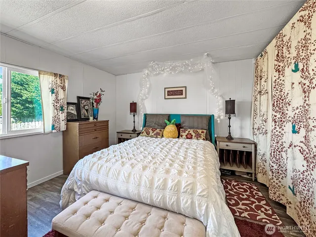 a bedroom with a bed and a table