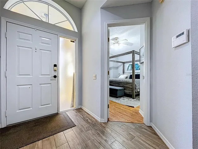 a large kitchen with stainless steel appliances lots of counter space and a sink