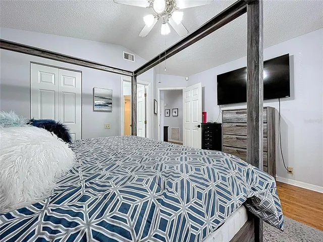 a view of walk in closet with clothes