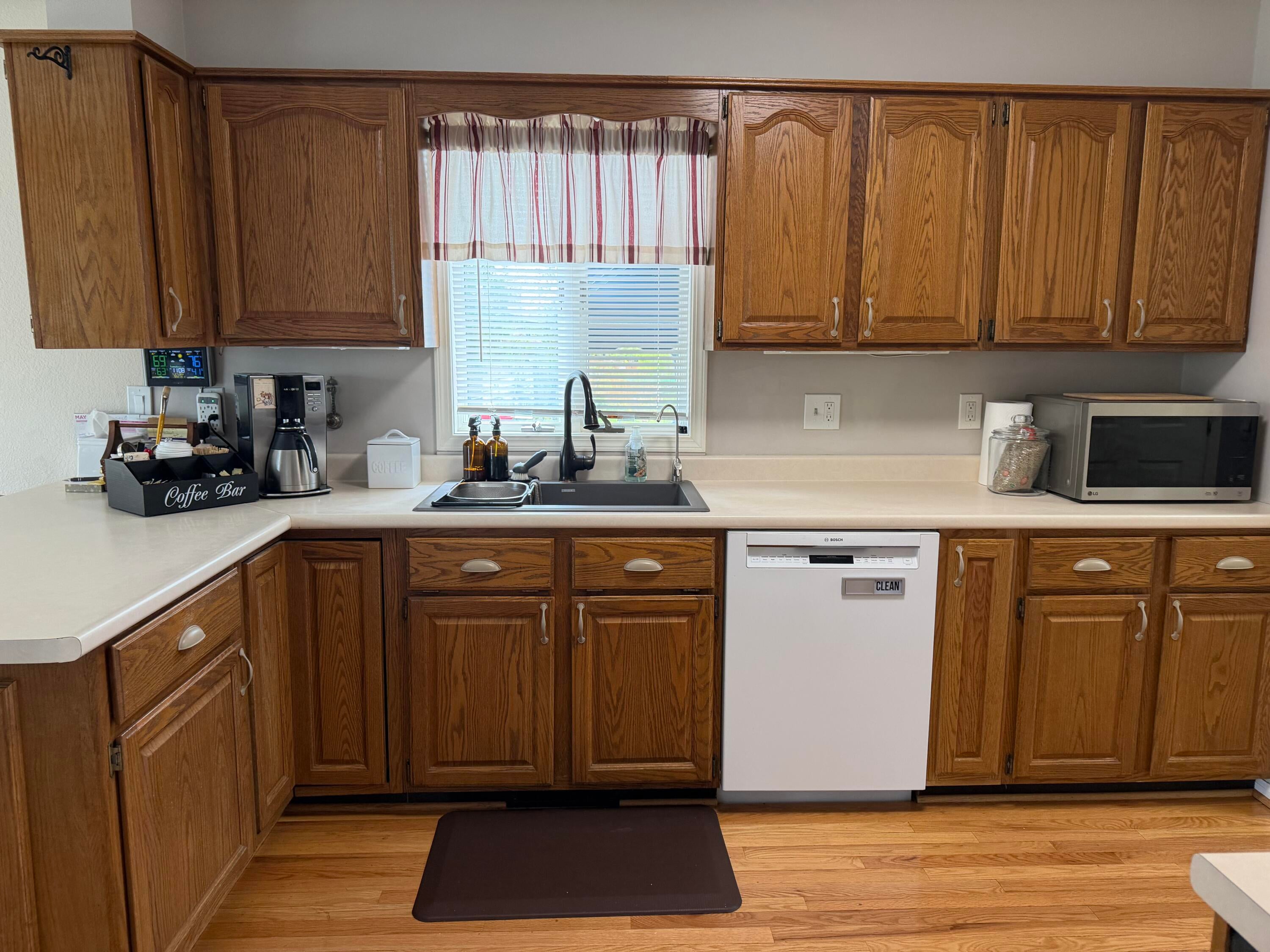 580 Long Rapids Road Alpena, MI 49707 - Photo 9 of 45 SPACIOUS KITCHEN WITH PLENTY OF COUNTERTOP, LAZY SUSAN AND PULL OUT SHELVES AND OSMOIS WATER DISPENCER.