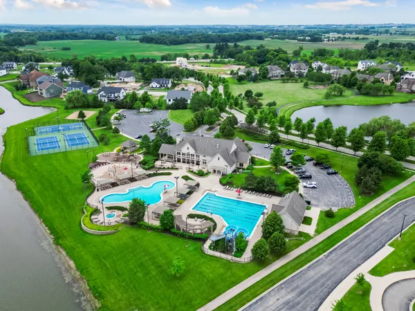 a view of a swimming pool with a yard