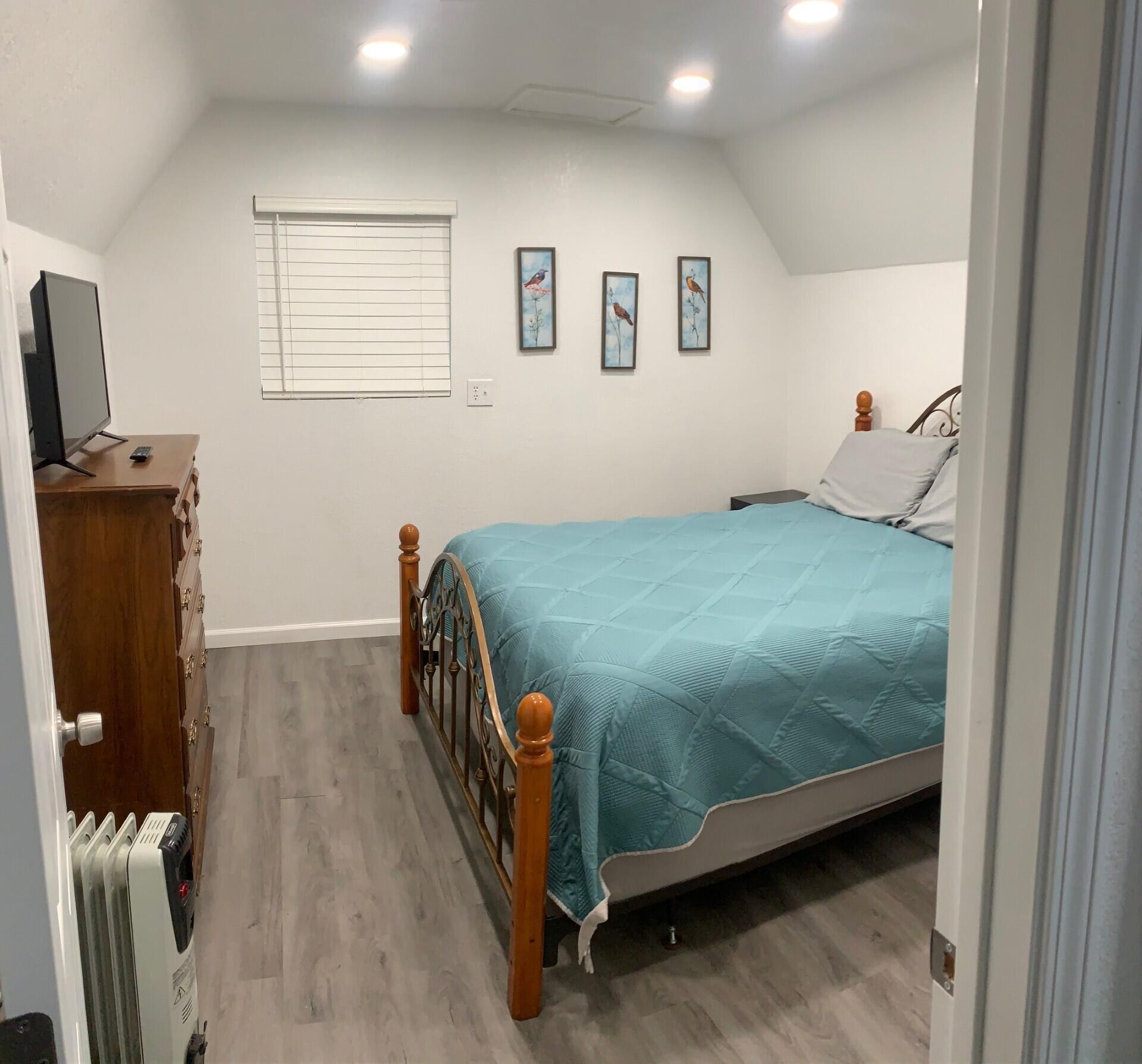 38082 State Highway Burney, CA 96013 - Photo 13 of 21 a bedroom with a bed and wooden floor