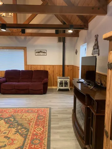 a living room with a couch and a stove
