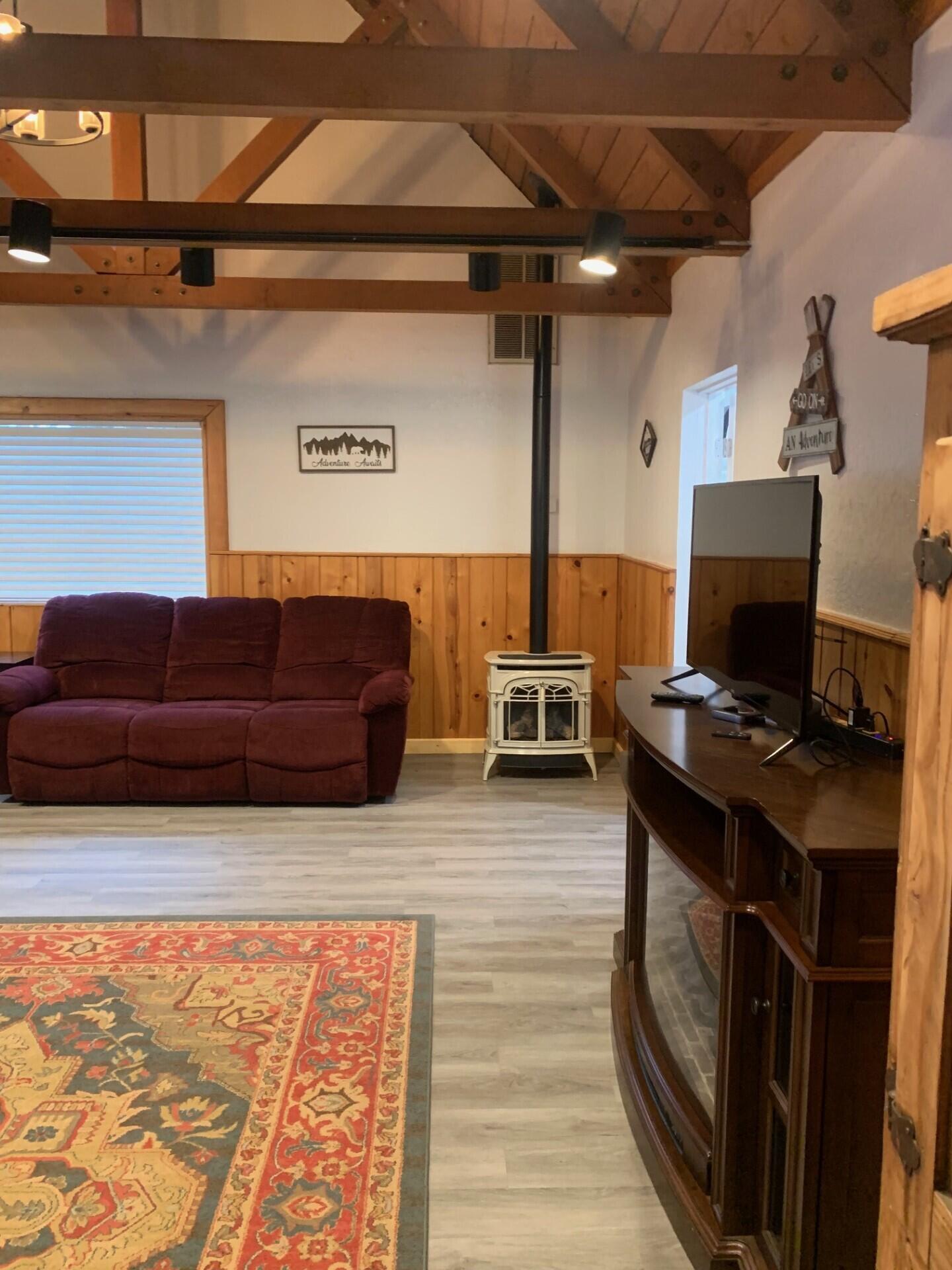 38082 State Highway Burney, CA 96013 - Photo 7 of 21 a living room with a couch and a stove