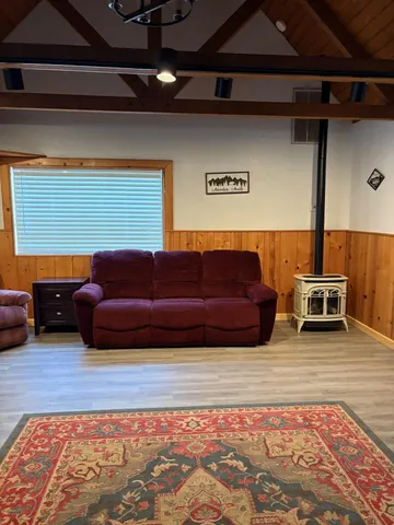 a blue bed sitting in a room next to a lamp