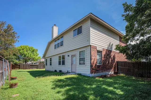 a view of backyard with a garden and entertaining space