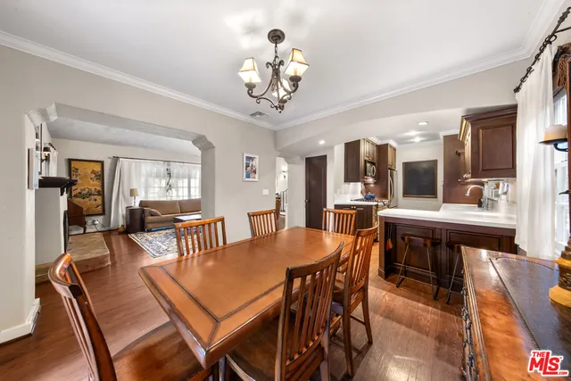 a bathroom with a tub shower and sink