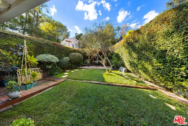 a front view of a house with yard