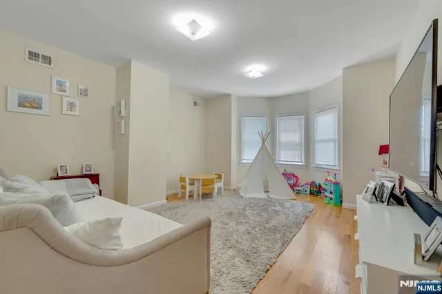 a bathroom with a sink mirror and a bathtub