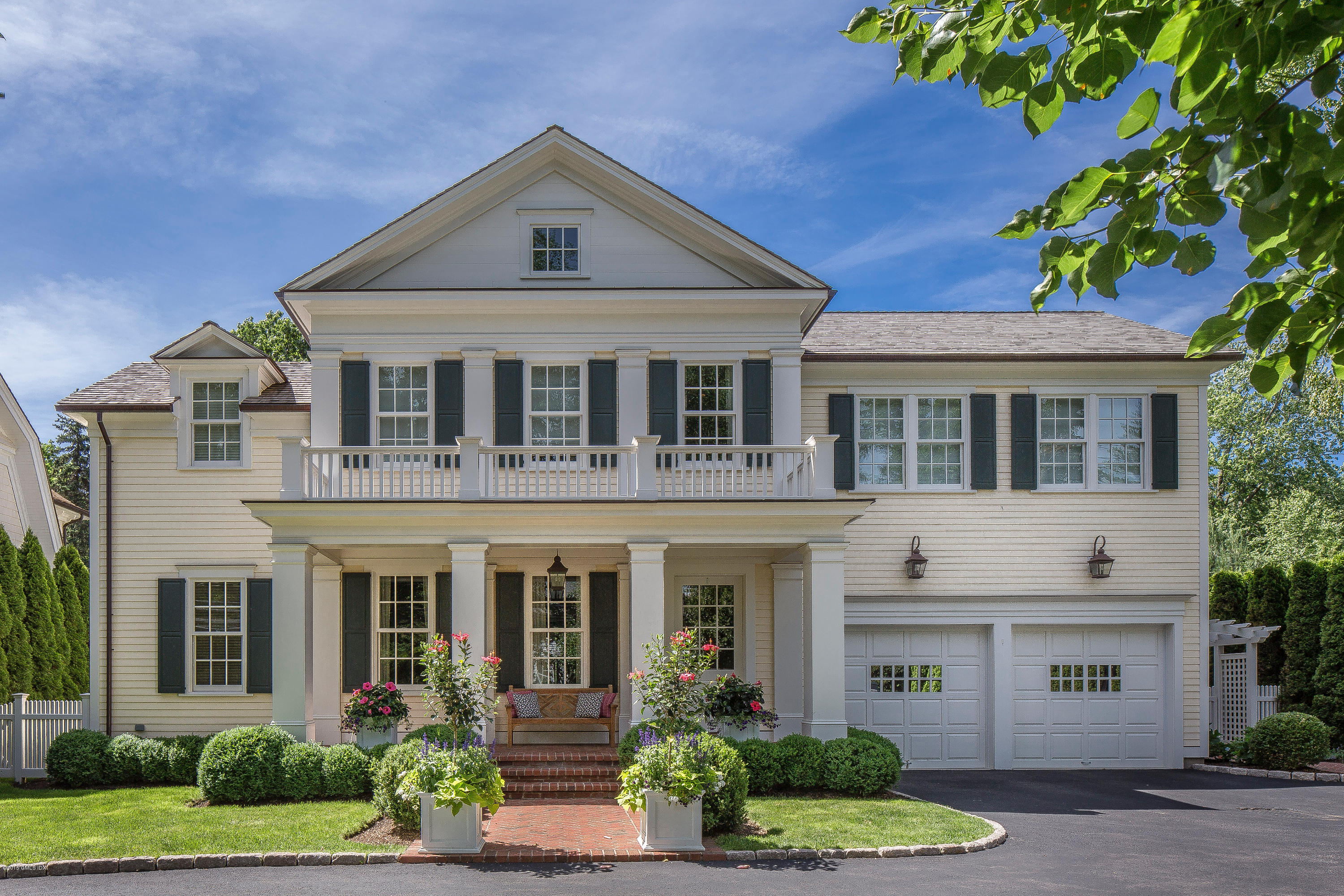 264 Riverside Avenue Riverside, CT 06878 - Photo 1 of 27 a front view of a house with a yard and potted plants