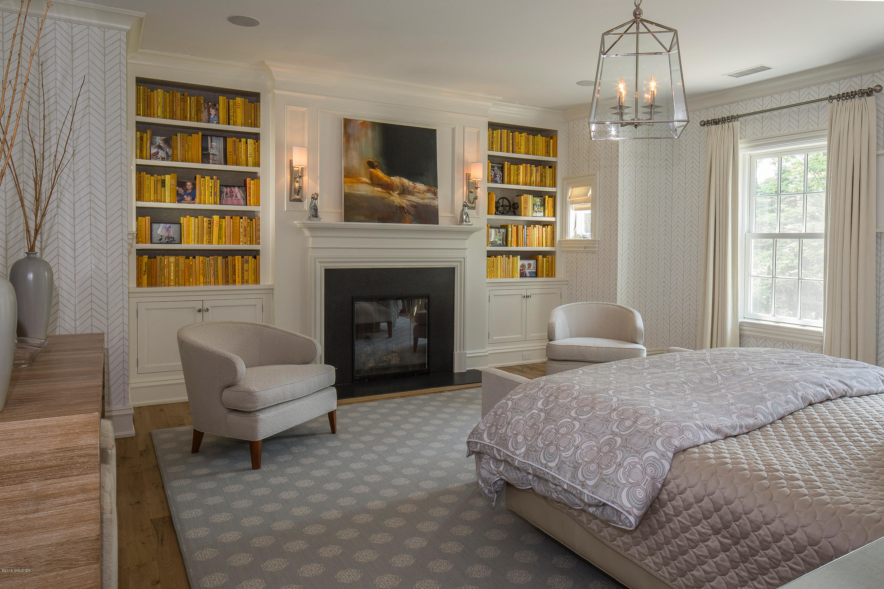 264 Riverside Avenue Riverside, CT 06878 - Photo 14 of 27 a spacious bedroom with a bed and a fireplace