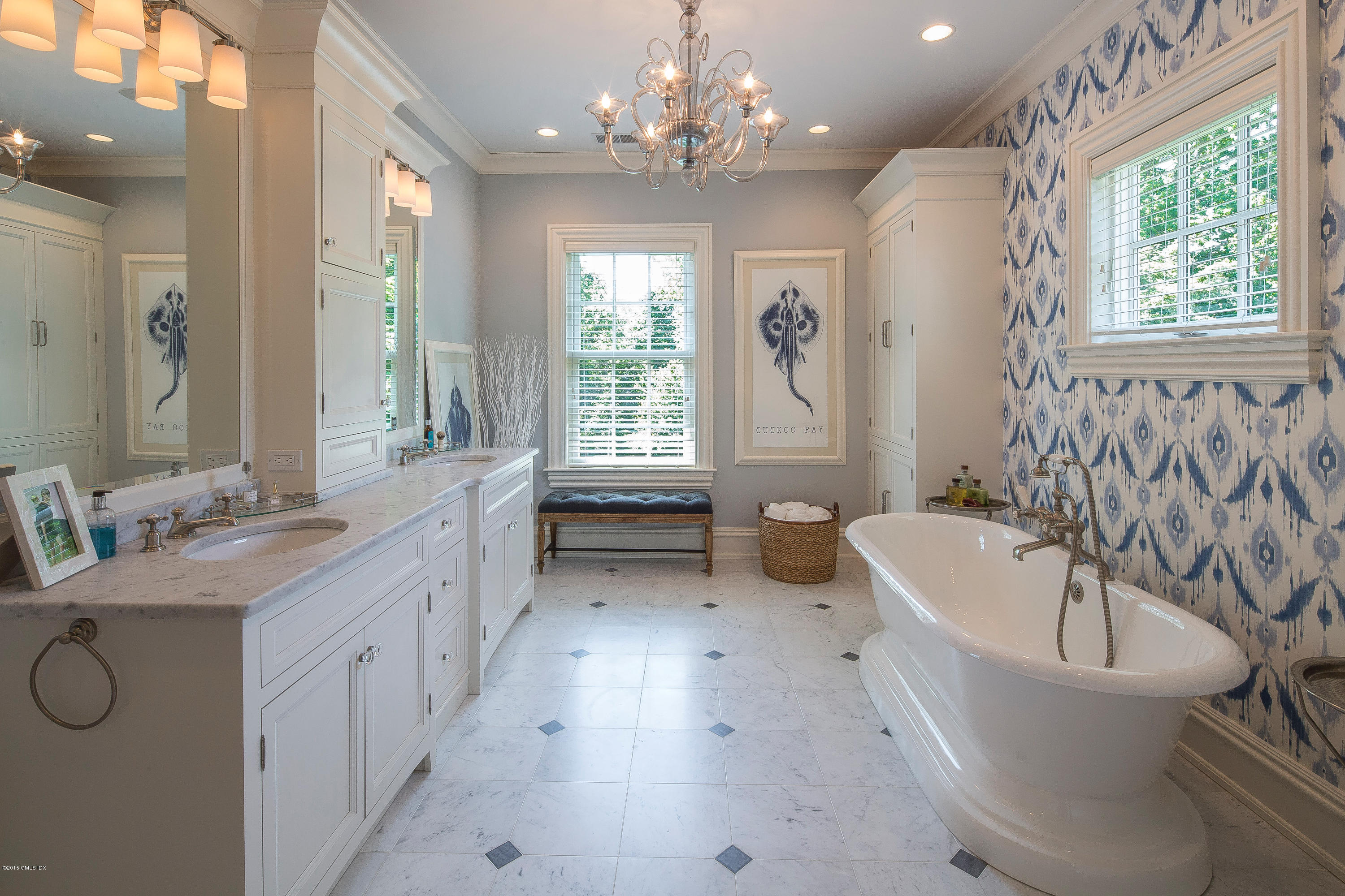 264 Riverside Avenue Riverside, CT 06878 - Photo 16 of 27 a spacious bathroom with a bathtub sink and mirror