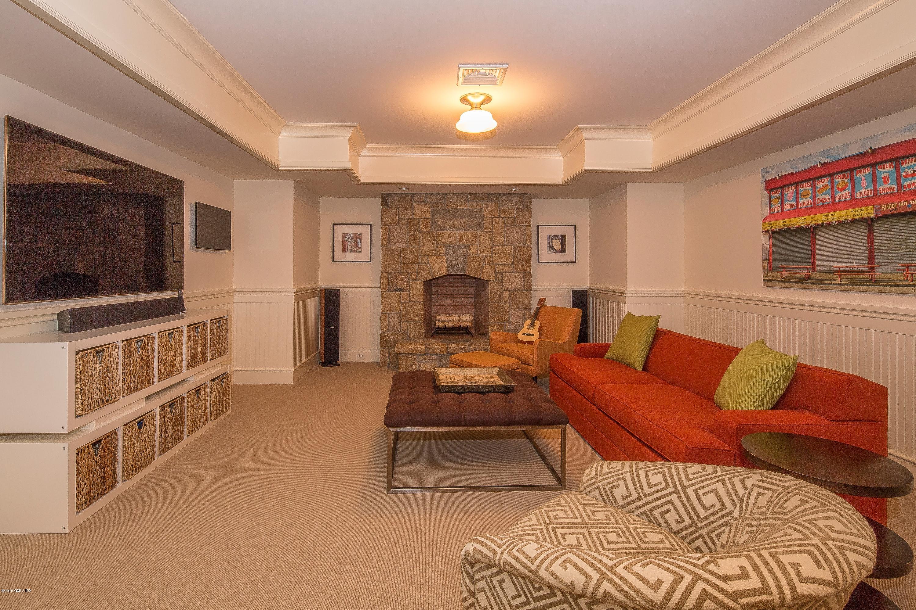 264 Riverside Avenue Riverside, CT 06878 - Photo 21 of 27 a living room with furniture and a flat screen tv