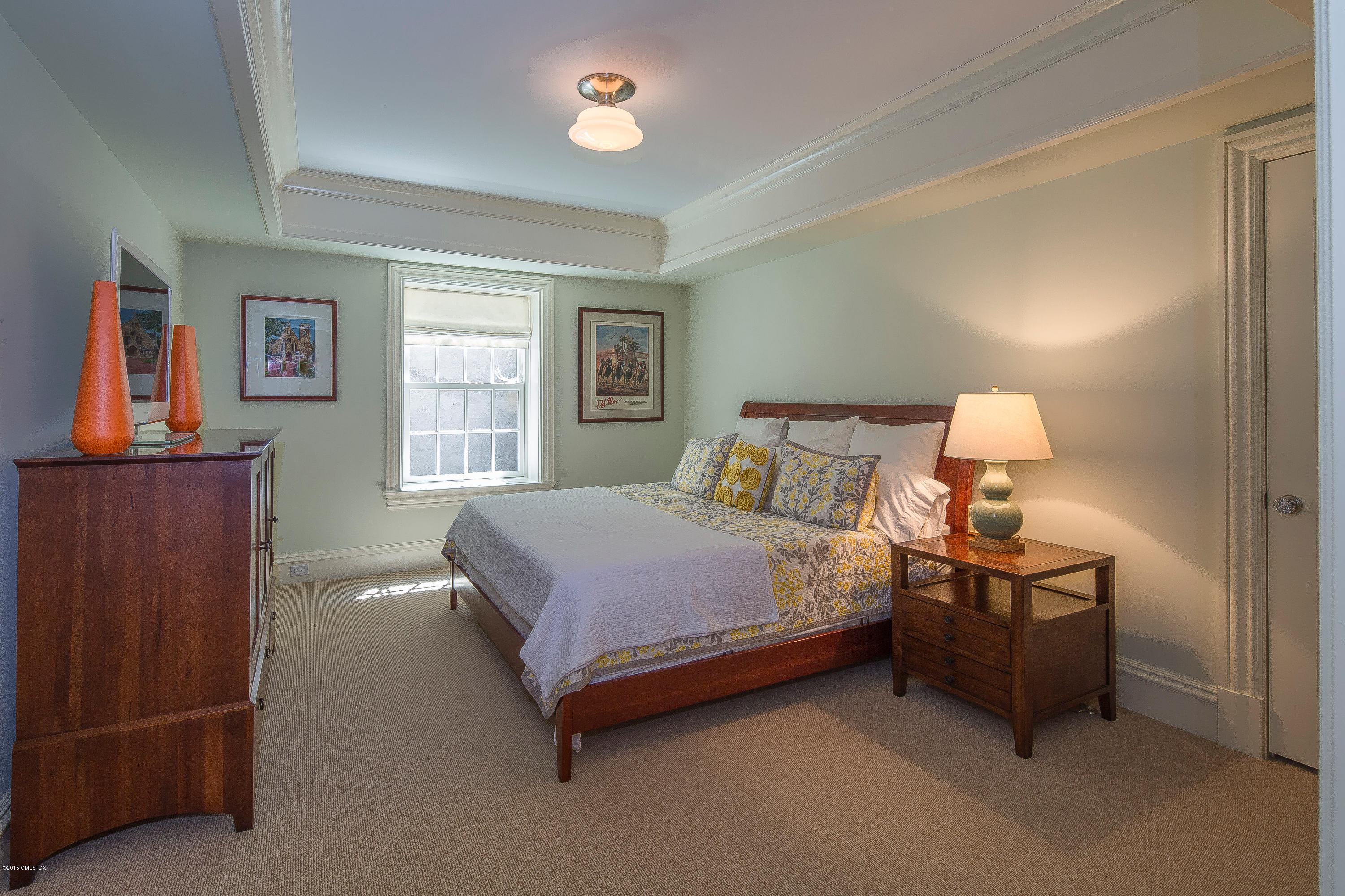 264 Riverside Avenue Riverside, CT 06878 - Photo 22 of 27 a bedroom with a bed and window