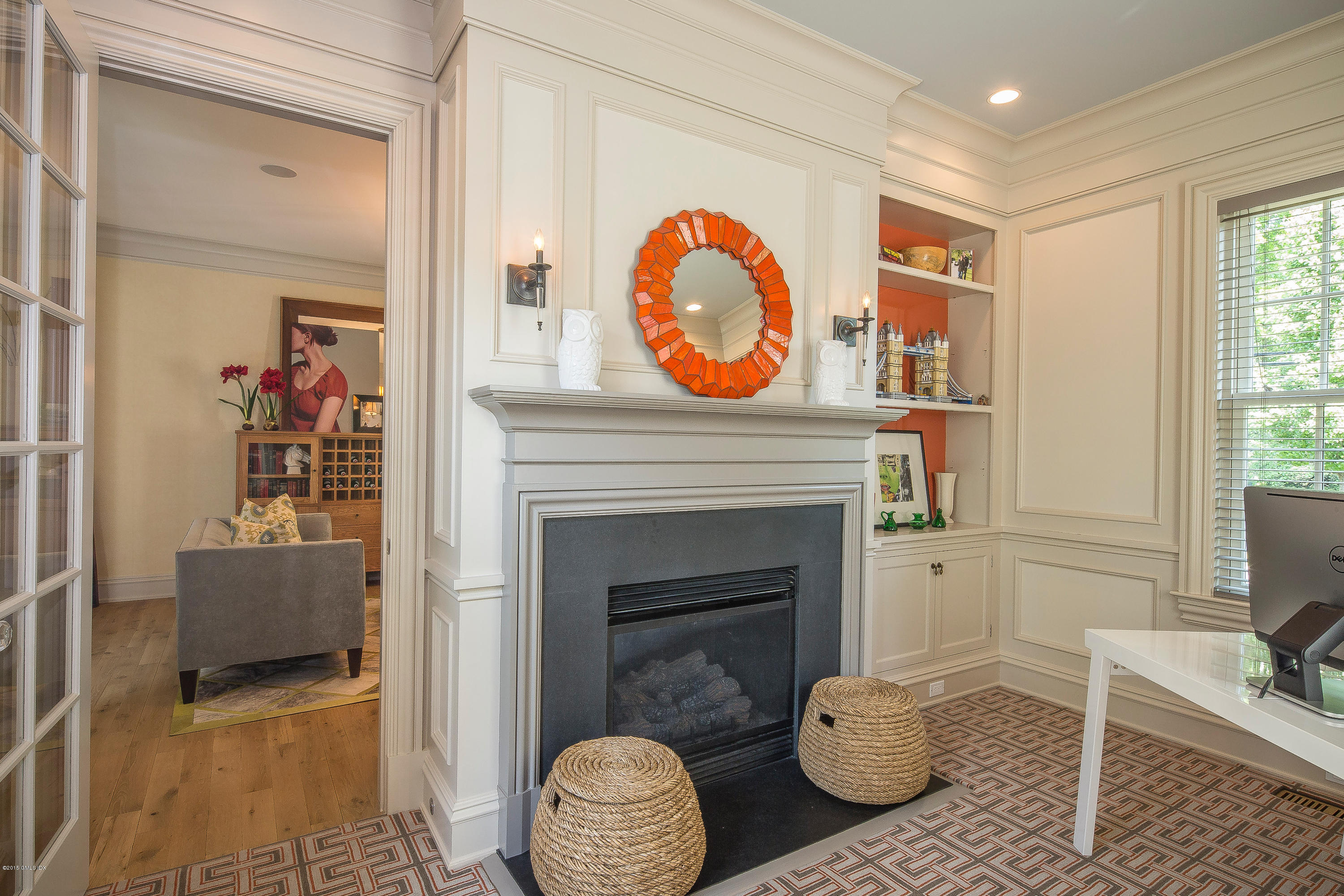 264 Riverside Avenue Riverside, CT 06878 - Photo 5 of 27 a living room with furniture a rug and a fireplace