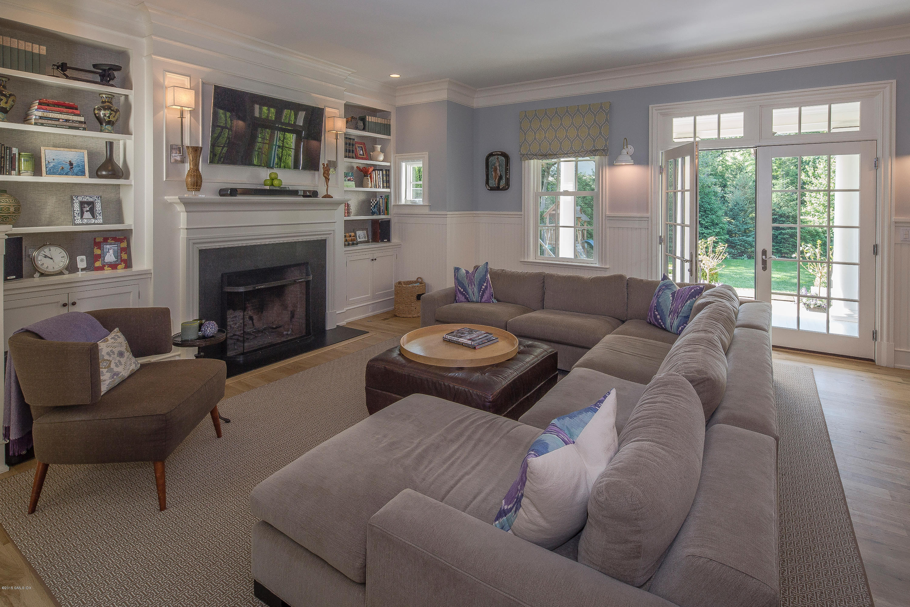 264 Riverside Avenue Riverside, CT 06878 - Photo 7 of 27 a living room with furniture and a fireplace