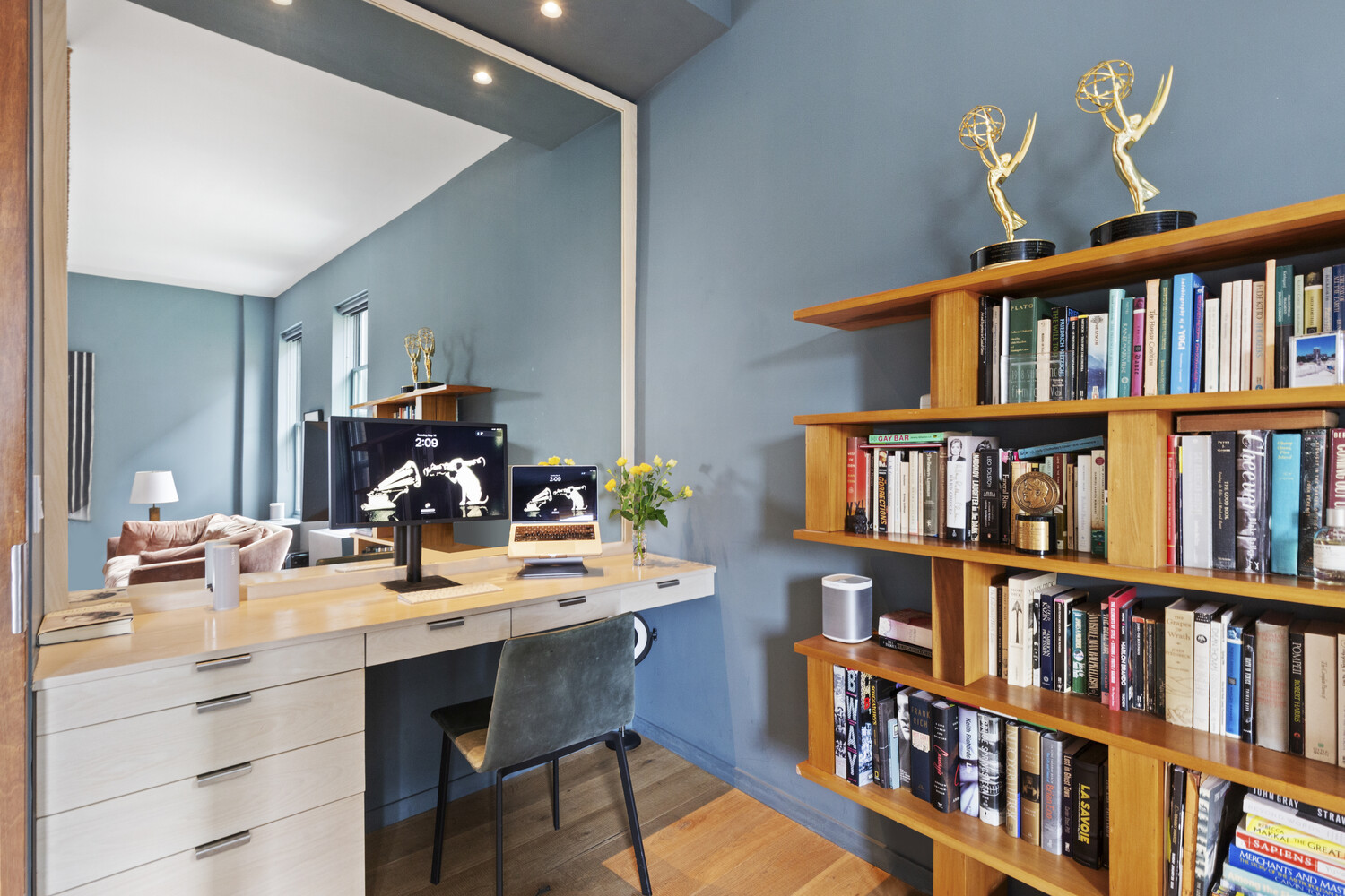 10 Bethune Street, Unit 4A Manhattan, NY 10014 - Photo 3 of 8 a workspace with a book shelf and a book shelf