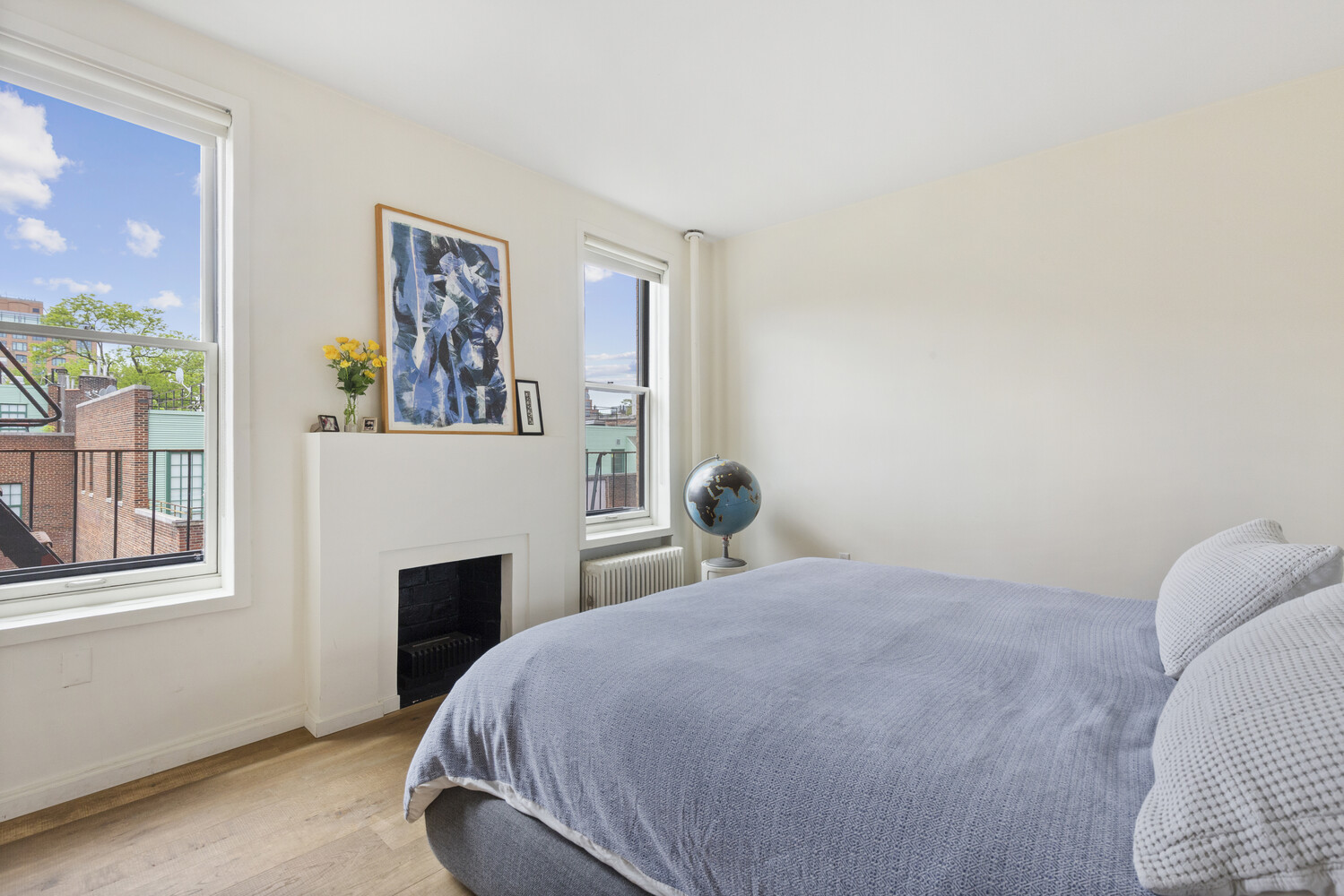 10 Bethune Street, Unit 4A Manhattan, NY 10014 - Photo 5 of 8 a bedroom with a bed and a window