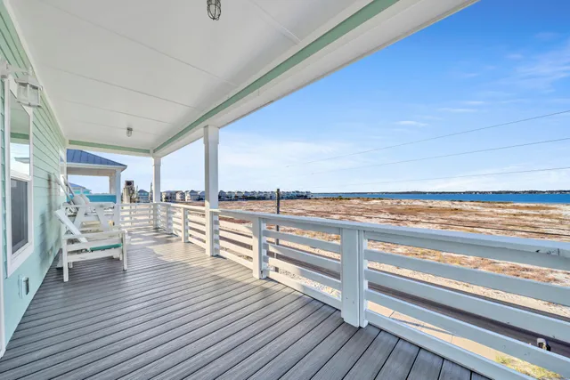 a view of a living room and wooden floor