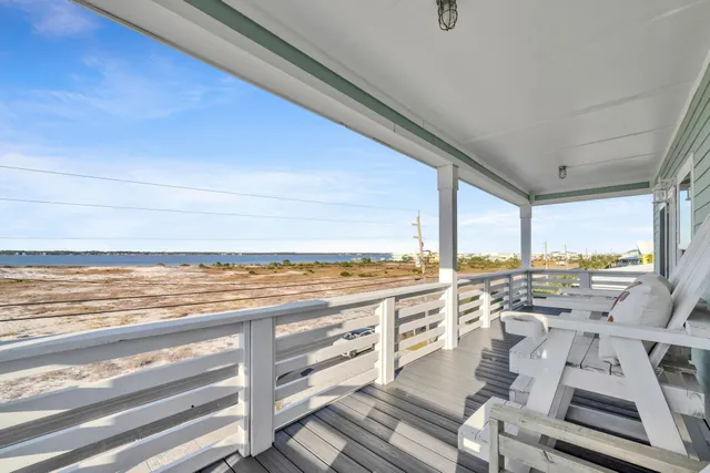a view of a kitchen with wooden floor