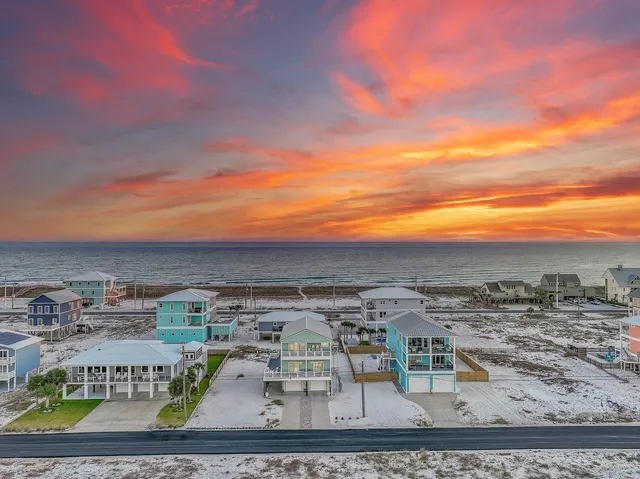 a view of a terrace with a table and chairs
