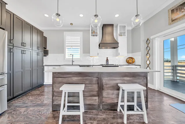 a kitchen with a sink cabinets and window