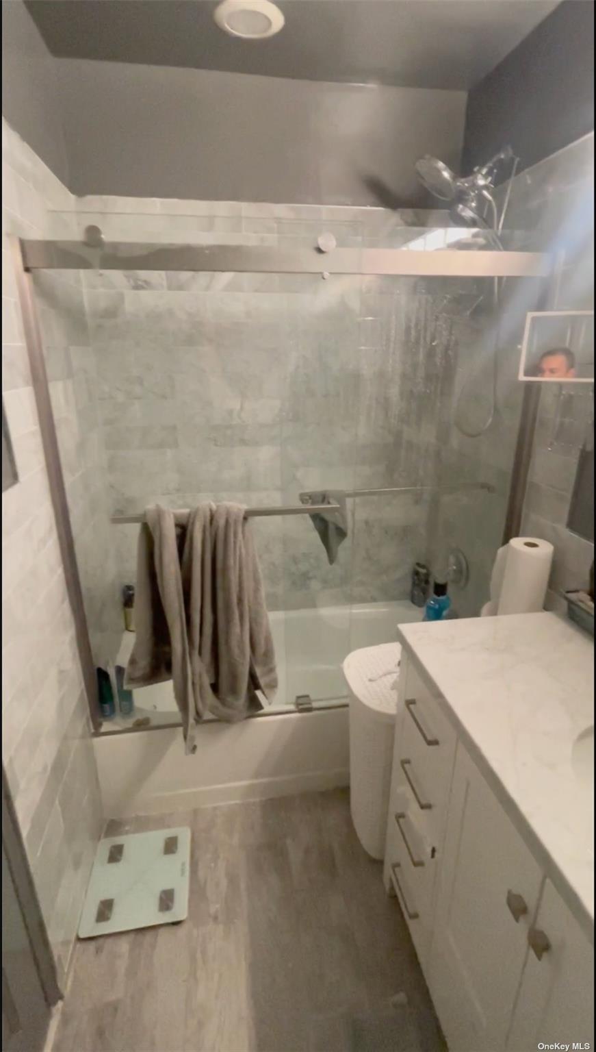 55 Tulip Avenue, Unit 63 Floral Park, NY 11001 - Photo 5 of 7 a bathroom with a sink a toilet and a shower