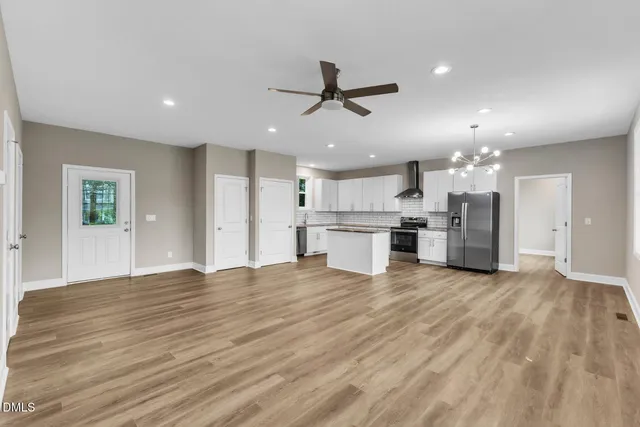 a view of kitchen with wooden floor and window