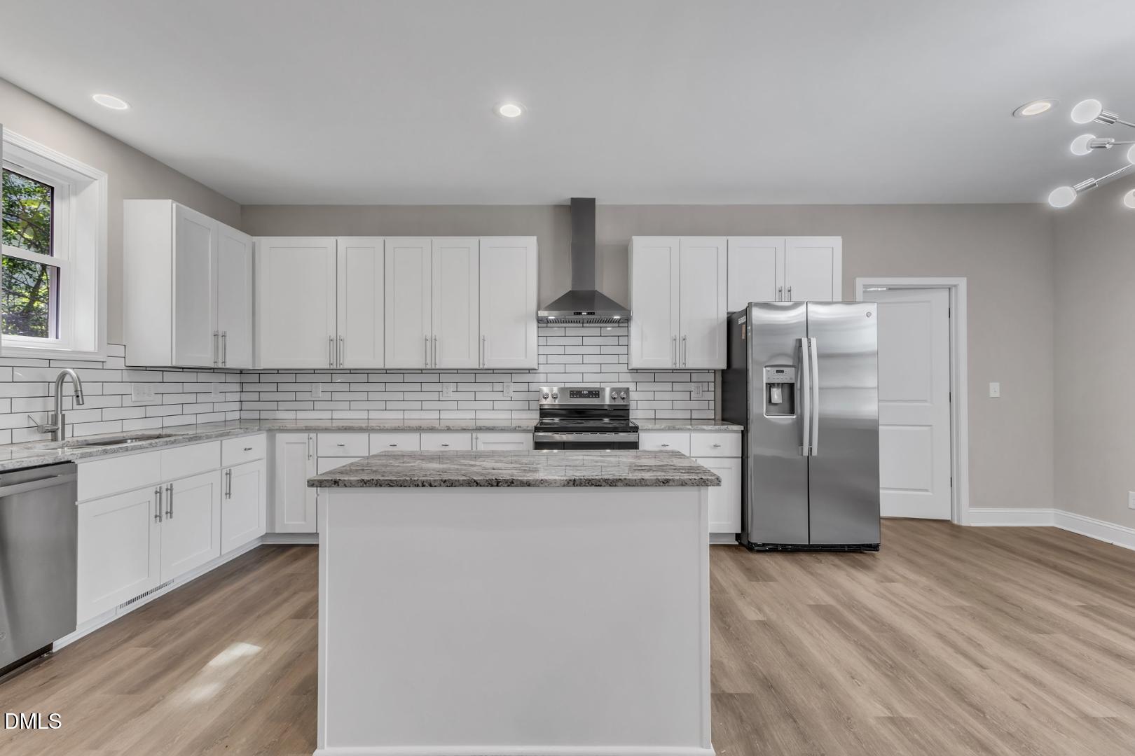 1521 Chapel Hill Road Durham, NC 27701 - Photo 11 of 42 a kitchen with stainless steel appliances granite countertop a refrigerator a stove and a sink