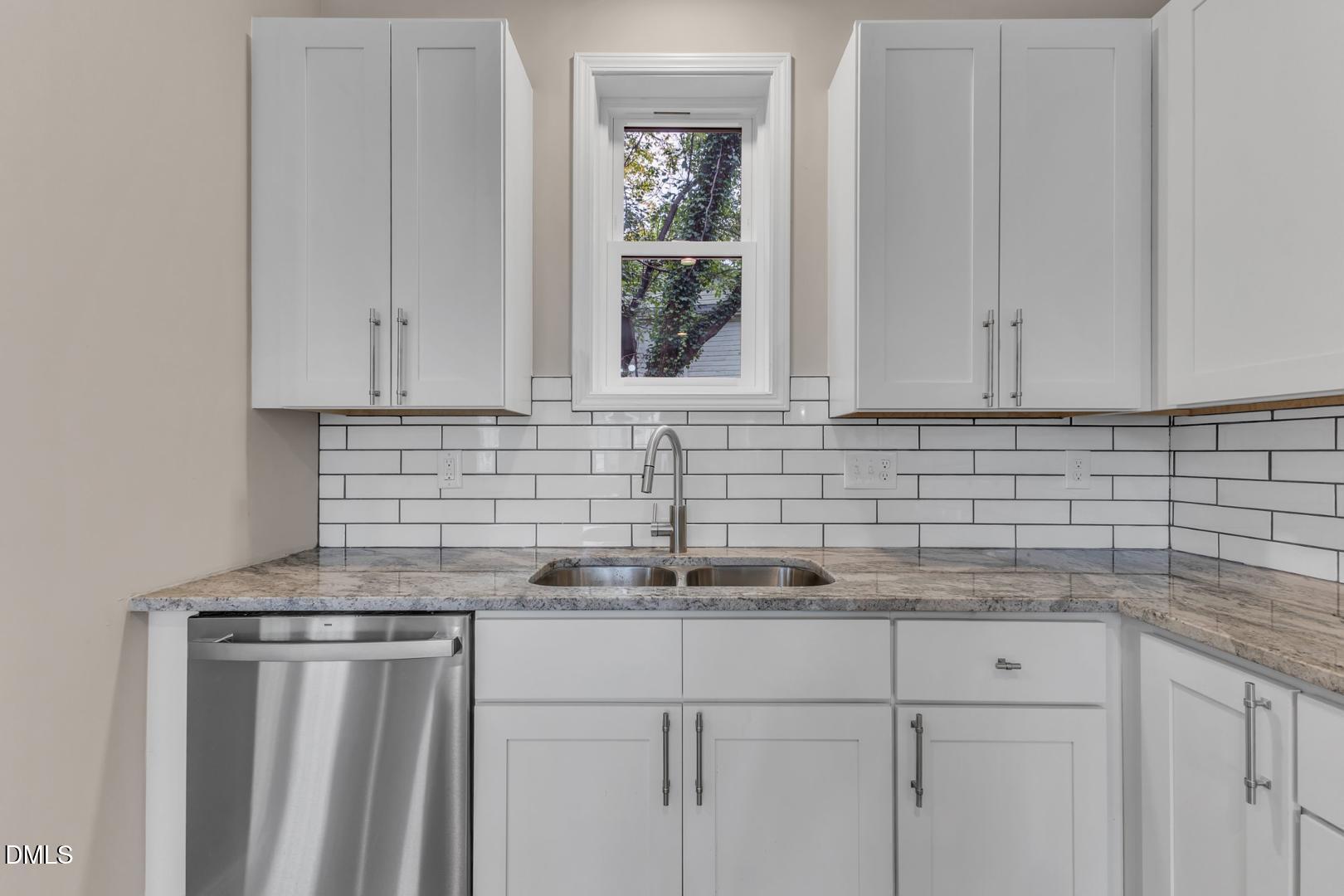 1521 Chapel Hill Road Durham, NC 27701 - Photo 14 of 42 a kitchen with stainless steel appliances granite countertop white cabinets and a stove