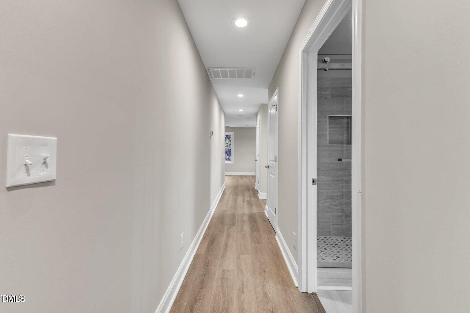 1521 Chapel Hill Road Durham, NC 27701 - Photo 22 of 42 a view of a hallway with wooden floor