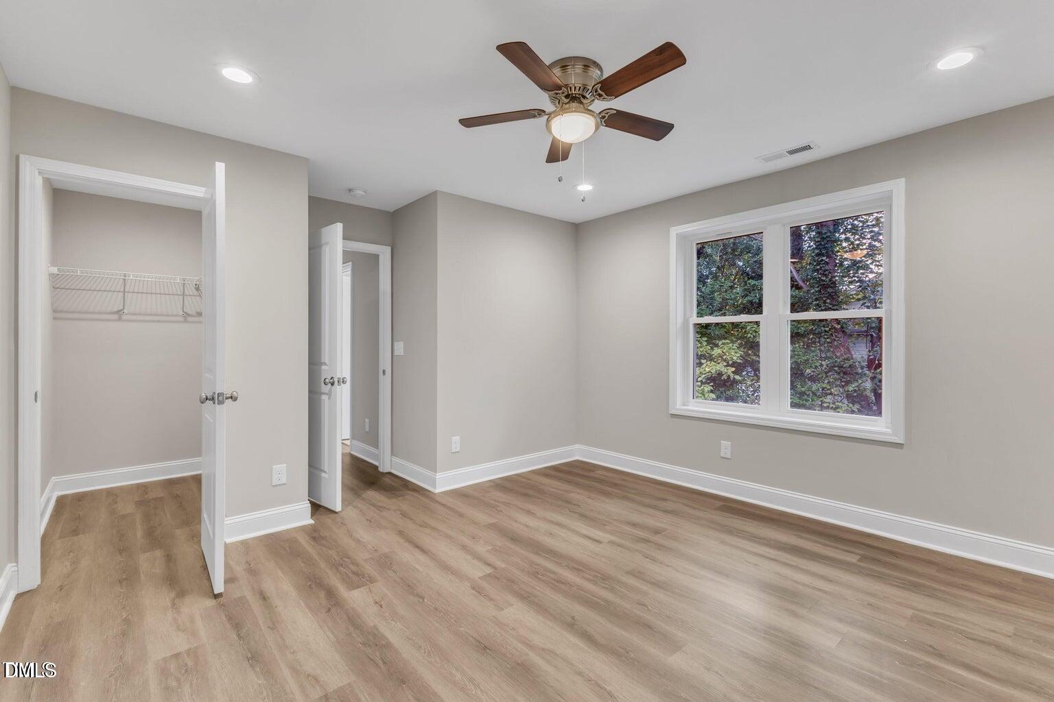 1521 Chapel Hill Road Durham, NC 27701 - Photo 29 of 42 wooden floor in an empty room with a window