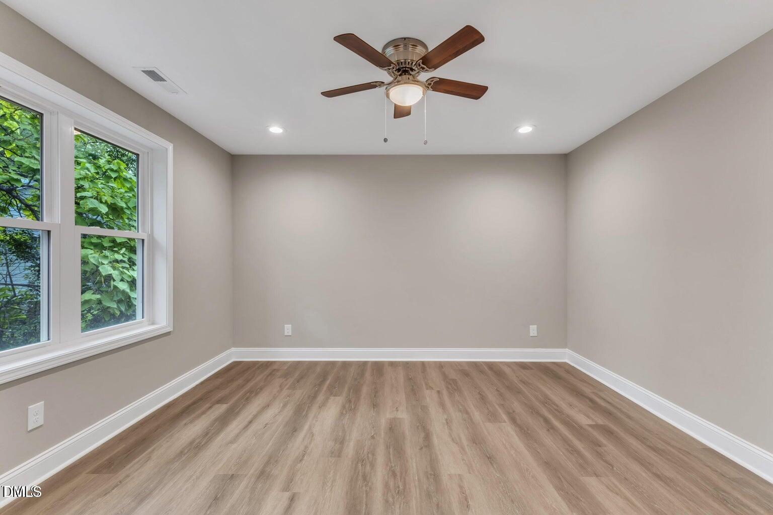 1521 Chapel Hill Road Durham, NC 27701 - Photo 30 of 42 wooden floor in an empty room with a window