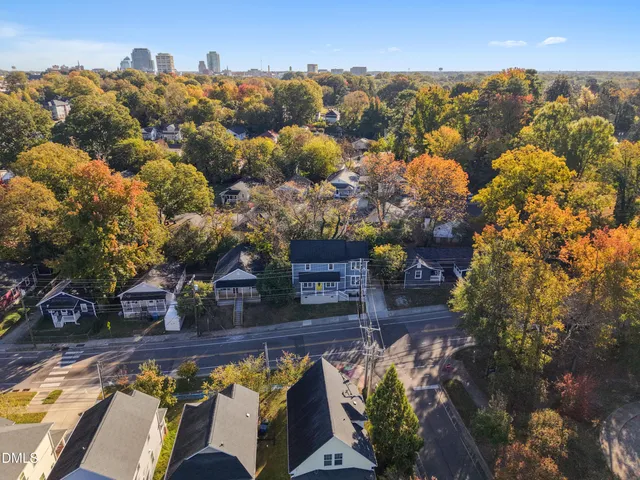 an aerial view of lake and residential houses with outdoor space