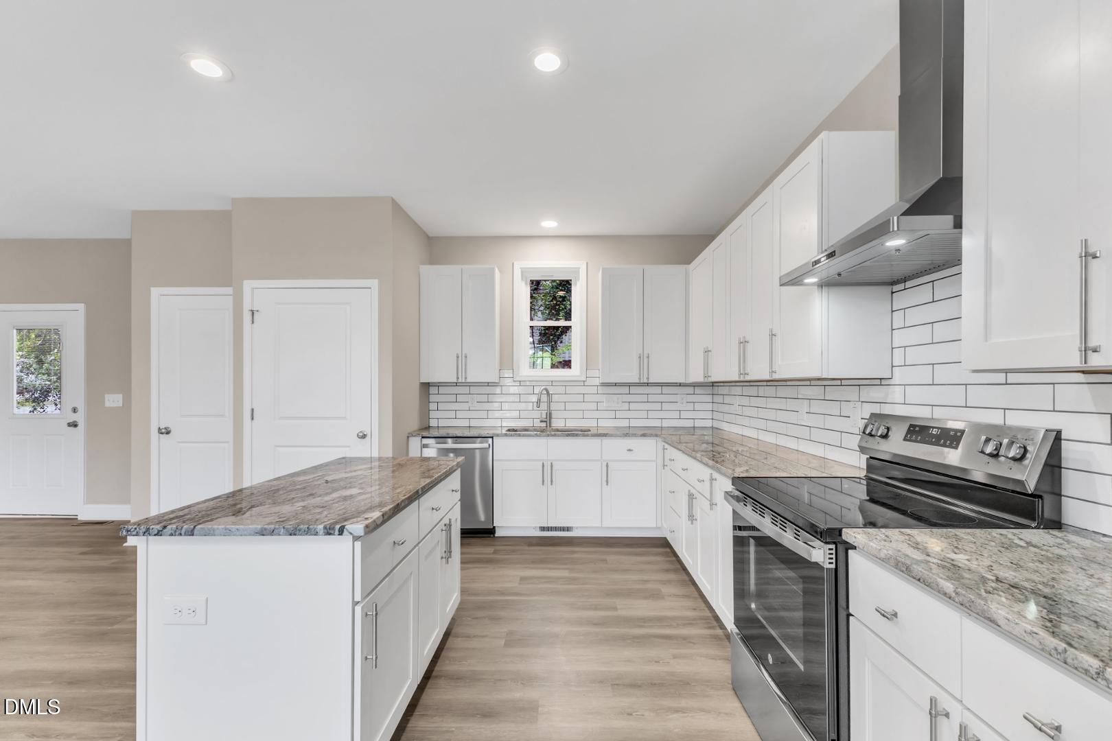 1521 Chapel Hill Road Durham, NC 27701 - Photo 10 of 42 a kitchen with a stove sink and cabinets