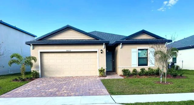 a front view of a house with yard