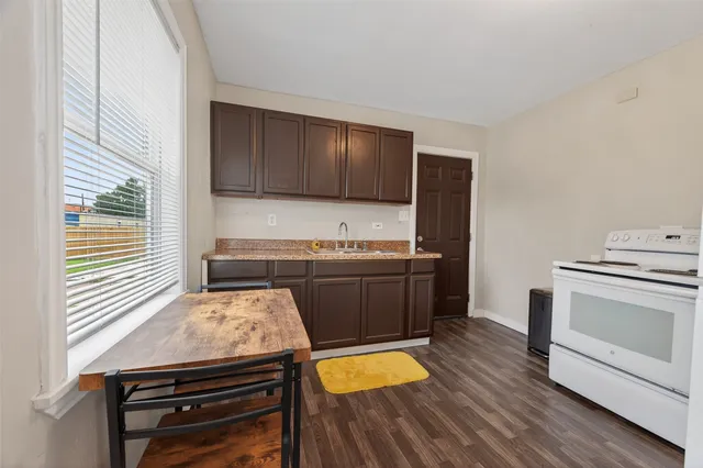 a kitchen with a stove and a microwave