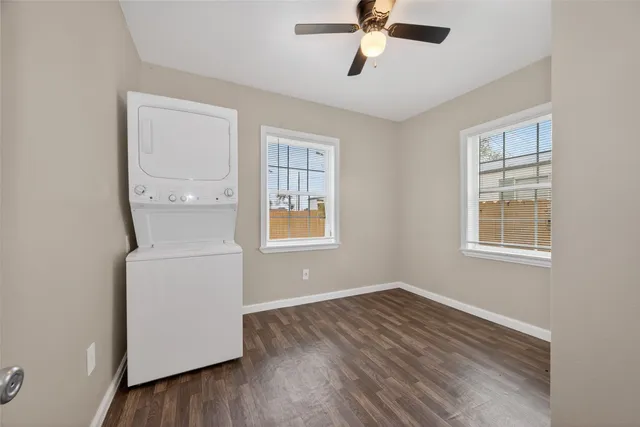 a room with a window and wooden floor