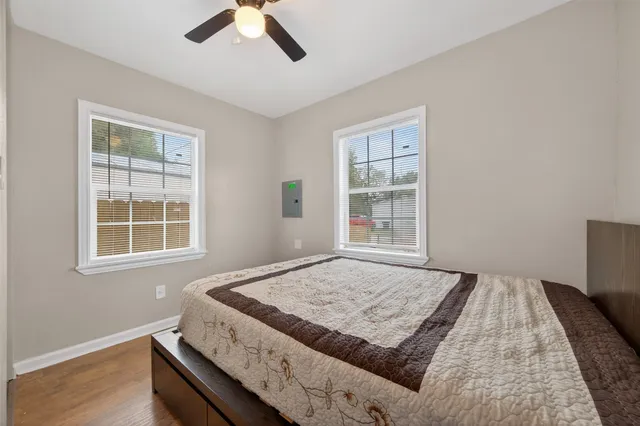 a bedroom with a bed and a window